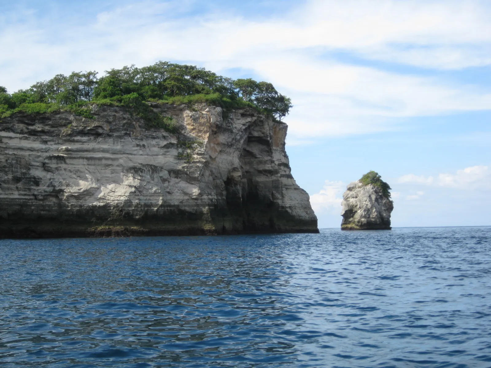 Tembeling Beach, Nusa Penida - forest-fringed beach with natural pools
