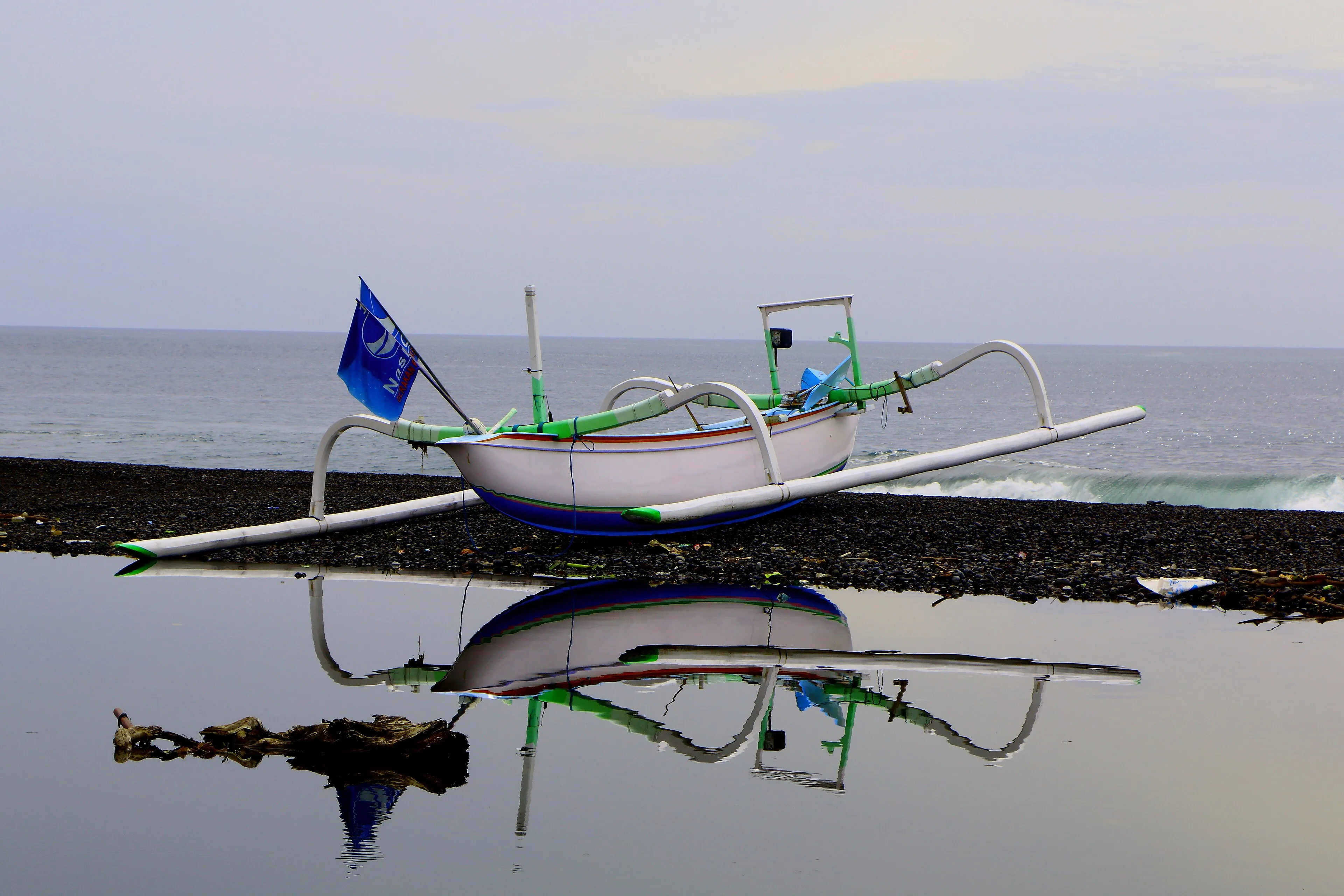 Kusamba Harbour, Klungkung, East Bali - traditional outrigger boats on the black-sand beach